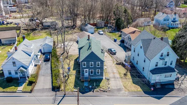 an aerial view of residential houses with outdoor space