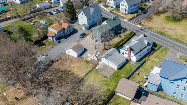 an aerial view of residential houses with outdoor space