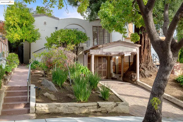 front view of a house with a garden
