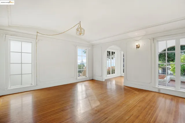 a view of an entryway with wooden floor and windows