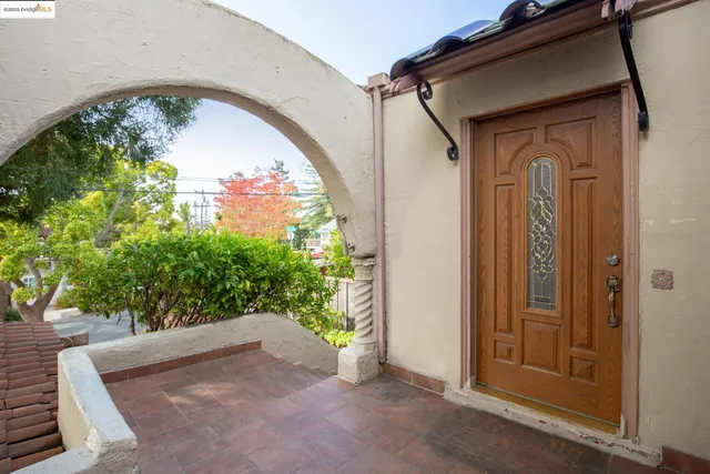 a view of entryway with wooden floor and door