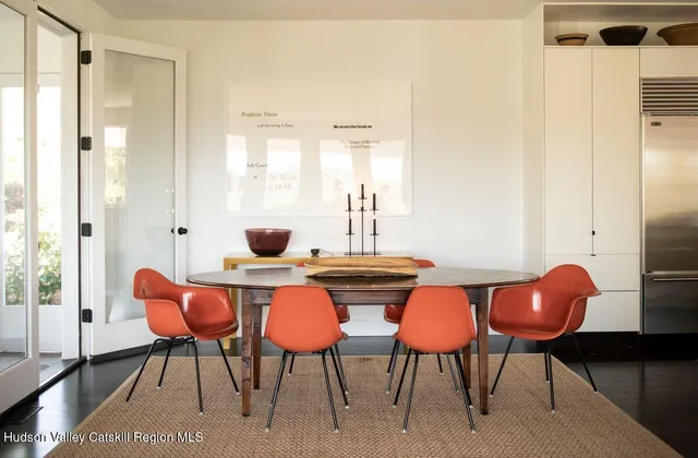 a dining room with furniture and wooden floor