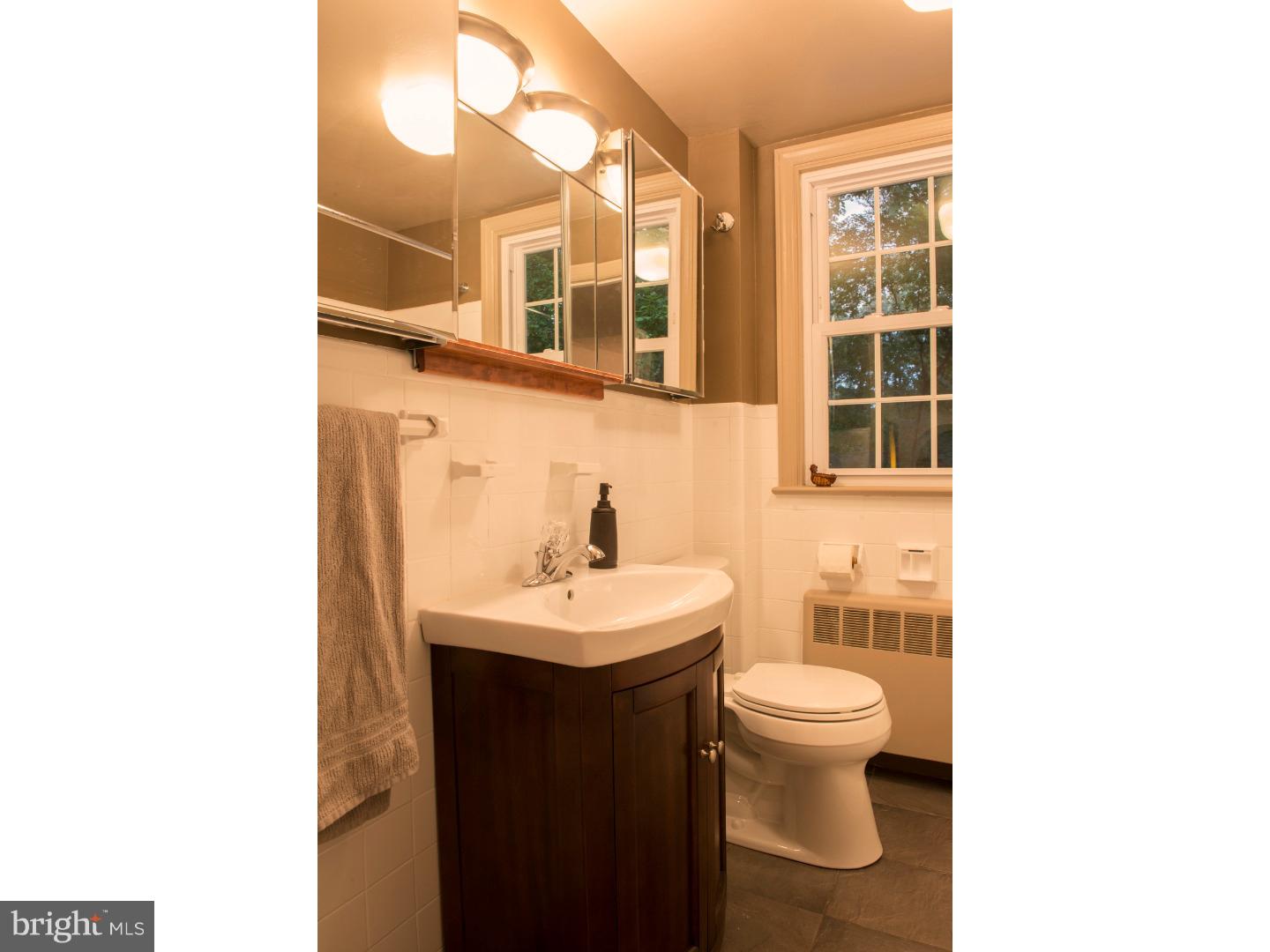 212 North Bent Road Wyncote, PA 19095 - Photo 20 of 25 a bathroom with a sink toilet and mirror