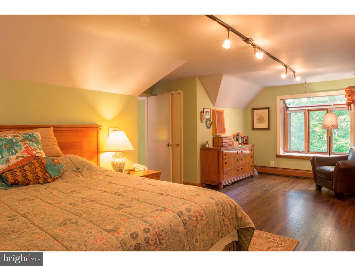 212 North Bent Road Wyncote, PA 19095 - Photo 21 of 25 a bedroom with a bed and wooden floor