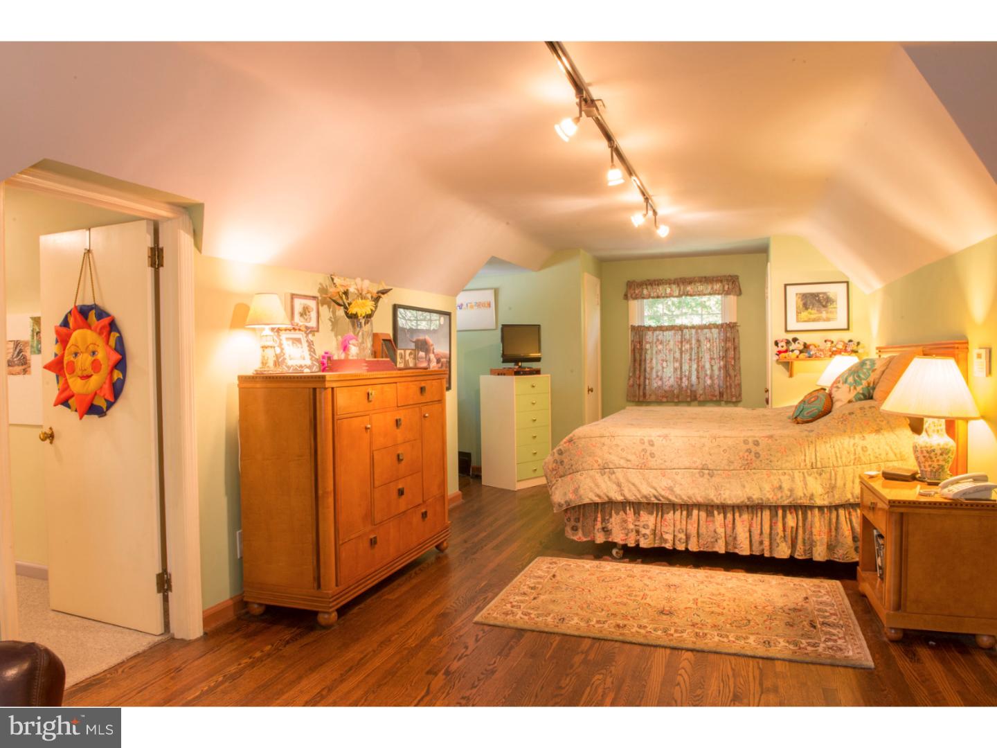 212 North Bent Road Wyncote, PA 19095 - Photo 22 of 25 a spacious bedroom with a bed and a cabinets