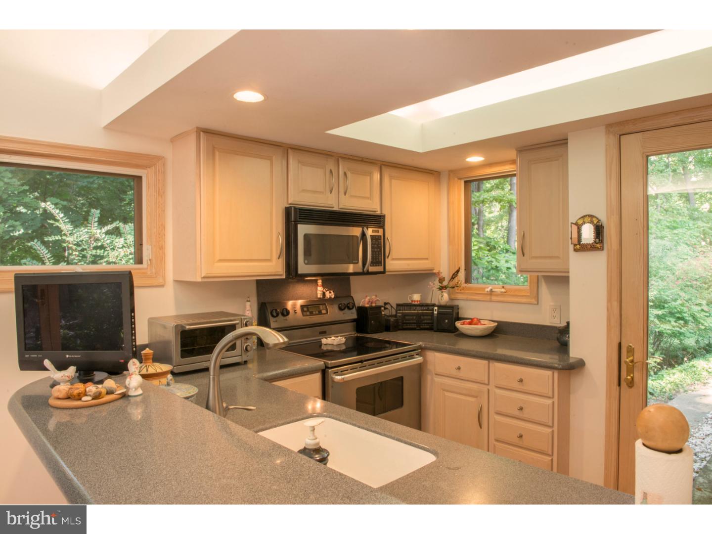 212 North Bent Road Wyncote, PA 19095 - Photo 6 of 25 a kitchen with a sink stove and microwave