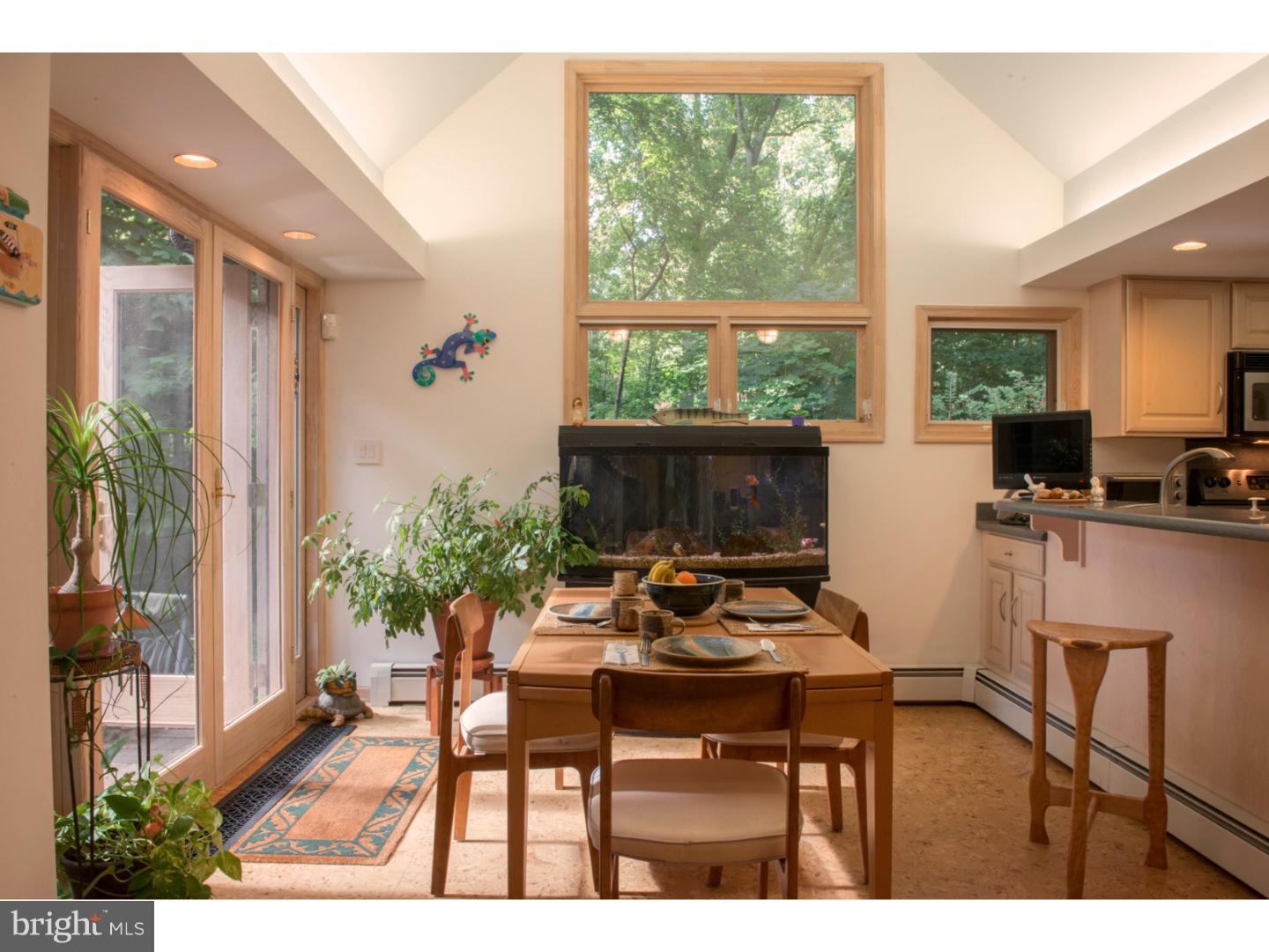 212 North Bent Road Wyncote, PA 19095 - Photo 7 of 25 a dining room with furniture and a floor to ceiling window