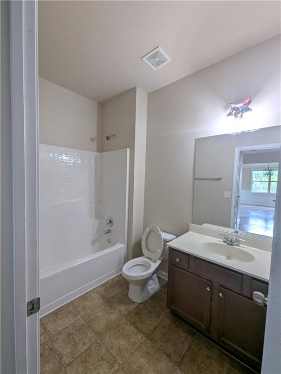 355 Fowler Springs Court Alpharetta, GA 30004 - Photo 11 of 16 a bathroom with a double vanity sink mirror and toilet