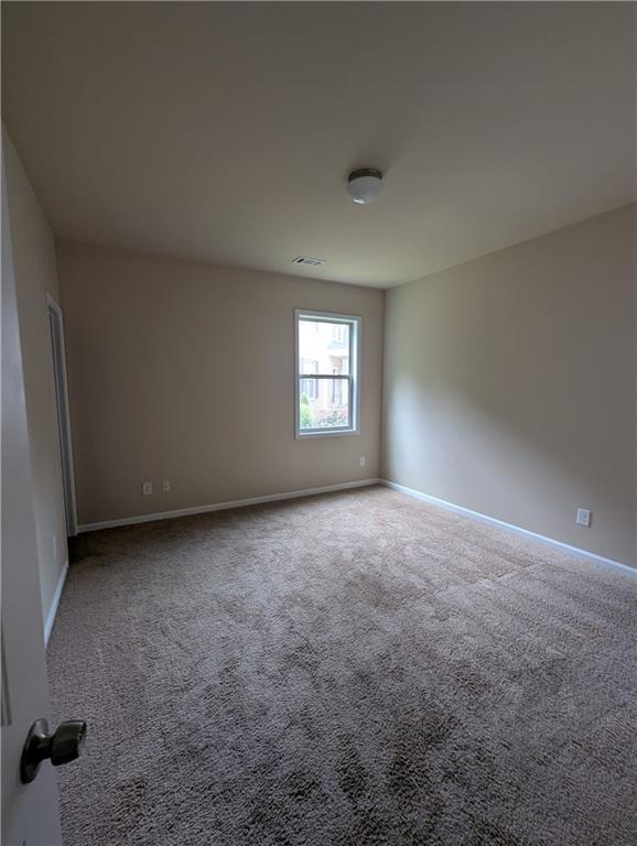 355 Fowler Springs Court Alpharetta, GA 30004 - Photo 12 of 16 an empty room with windows
