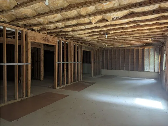 a view of an empty room with wooden walls