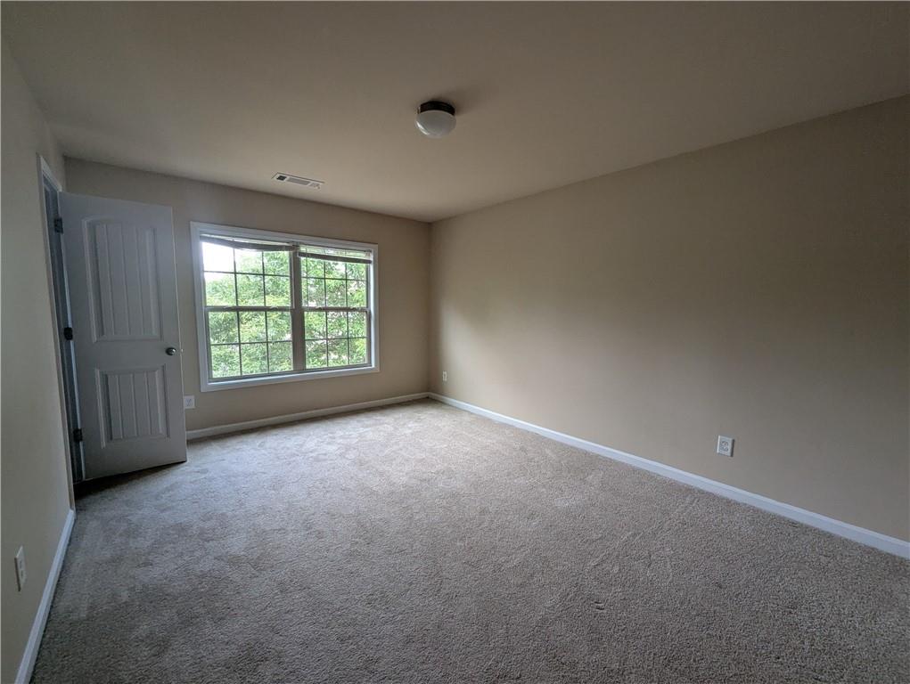 355 Fowler Springs Court Alpharetta, GA 30004 - Photo 10 of 16 an empty room with windows
