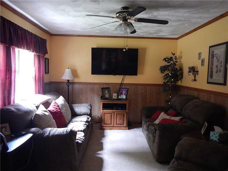 1520 Edgewood Road Beaver Falls, PA 15010 - Photo 6 of 17 Living Room. Living room with ceiling fan