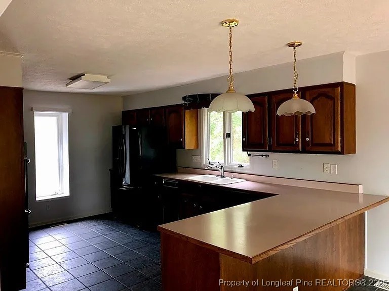 744 Azalea Drive Vass, NC 28394 - Photo 12 of 16 a kitchen with sink and window