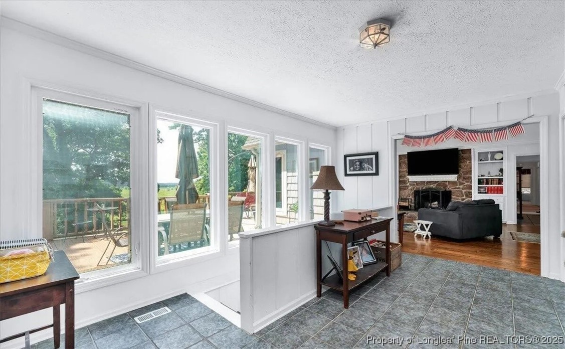 744 Azalea Drive Vass, NC 28394 - Photo 13 of 16 a living room with furniture and a flat screen tv