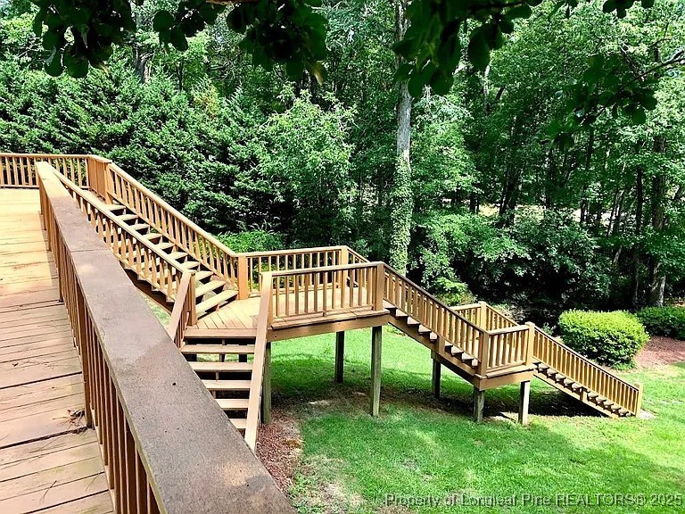 744 Azalea Drive Vass, NC 28394 - Photo 3 of 16 a view of a chair and table in the backyard