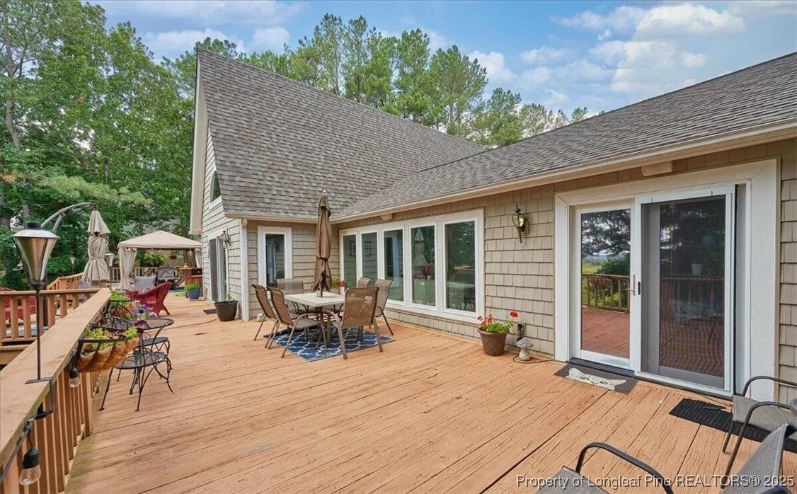 744 Azalea Drive Vass, NC 28394 - Photo 5 of 16 a backyard of a house with seating space