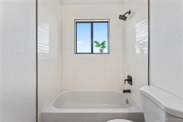 a close up of a bathtub curtain