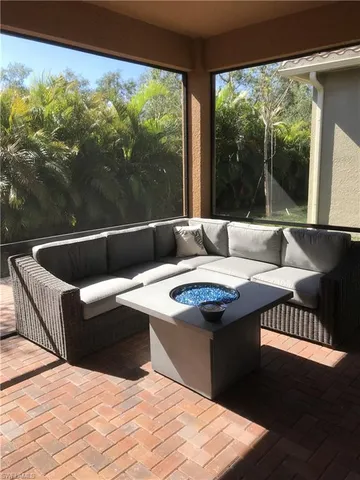 a living room with a couch and large window