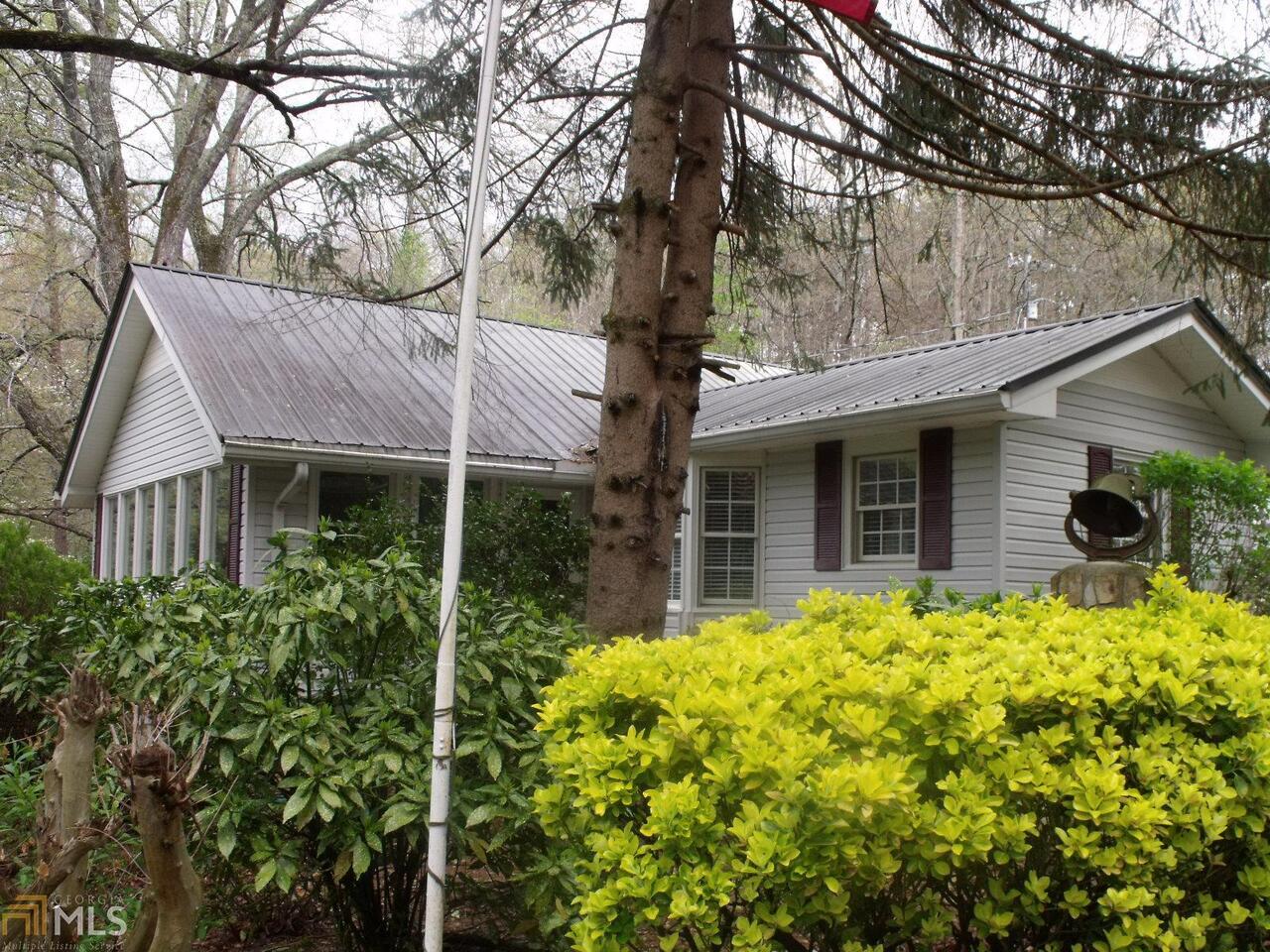 380 Rose Road Cleveland, GA 30528 - Photo 1 of 1 a front view of house with yard and trees around