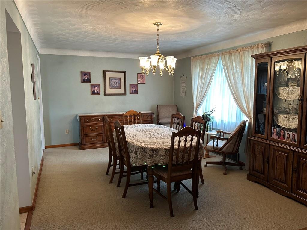 356 3rd Street Smithton, PA 15479 - Photo 5 of 15 a view of a dining room with furniture window and wooden floor