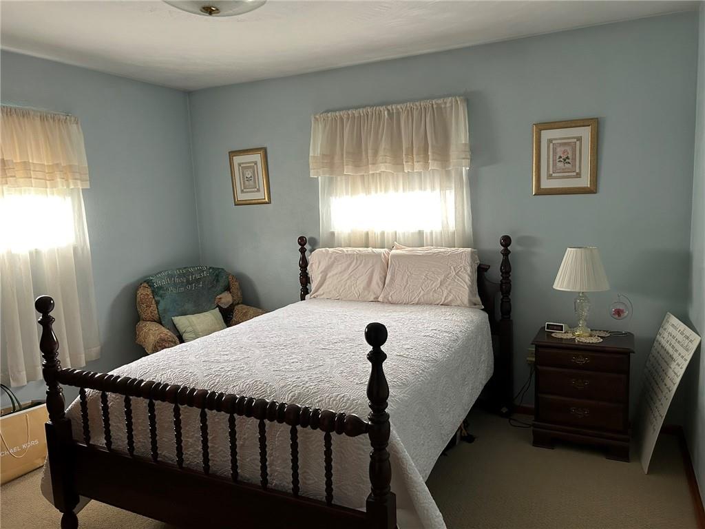 356 3rd Street Smithton, PA 15479 - Photo 10 of 15 a bedroom with a bed and a window