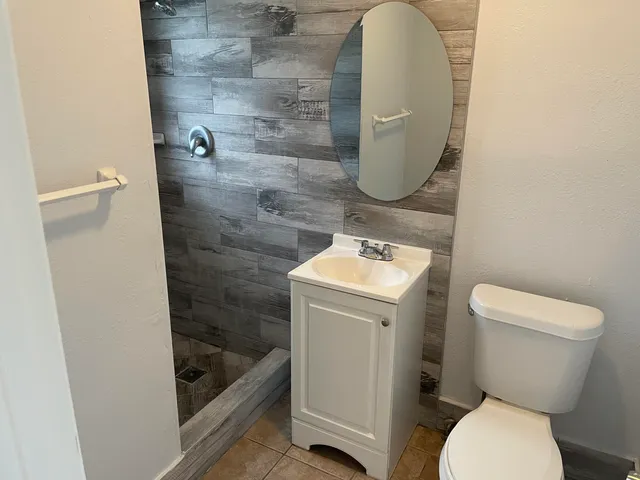 a bathroom with a toilet and a sink