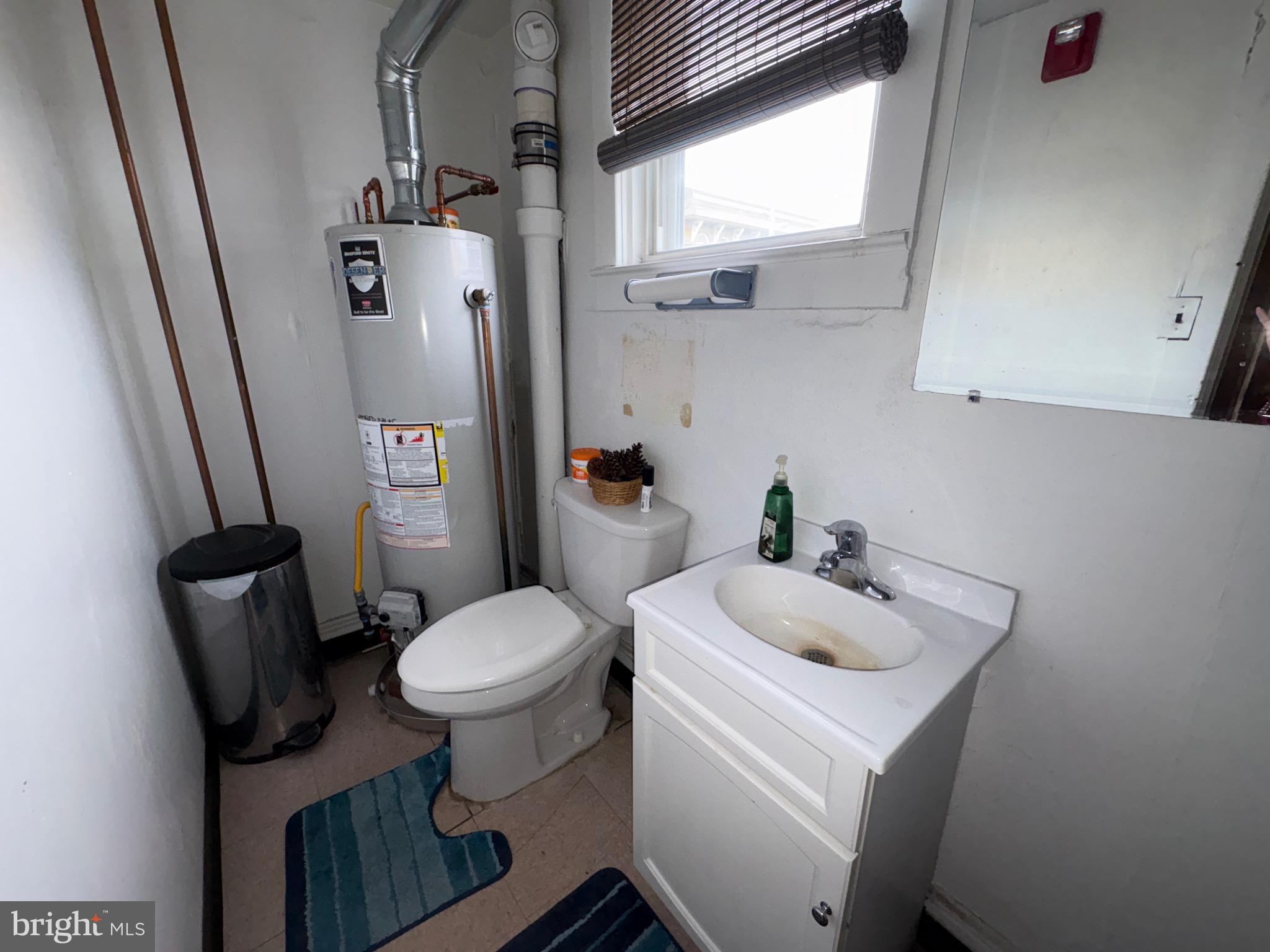 15 South Forklanding Road Maple Shade, NJ 08052 - Photo 12 of 30 a bathroom with a sink toilet and window