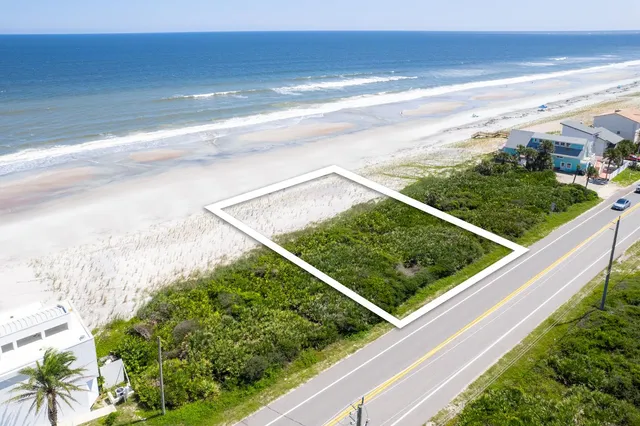 a view of a floor to ceiling window and an ocean view