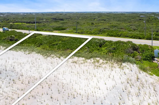 a view of a field with an ocean