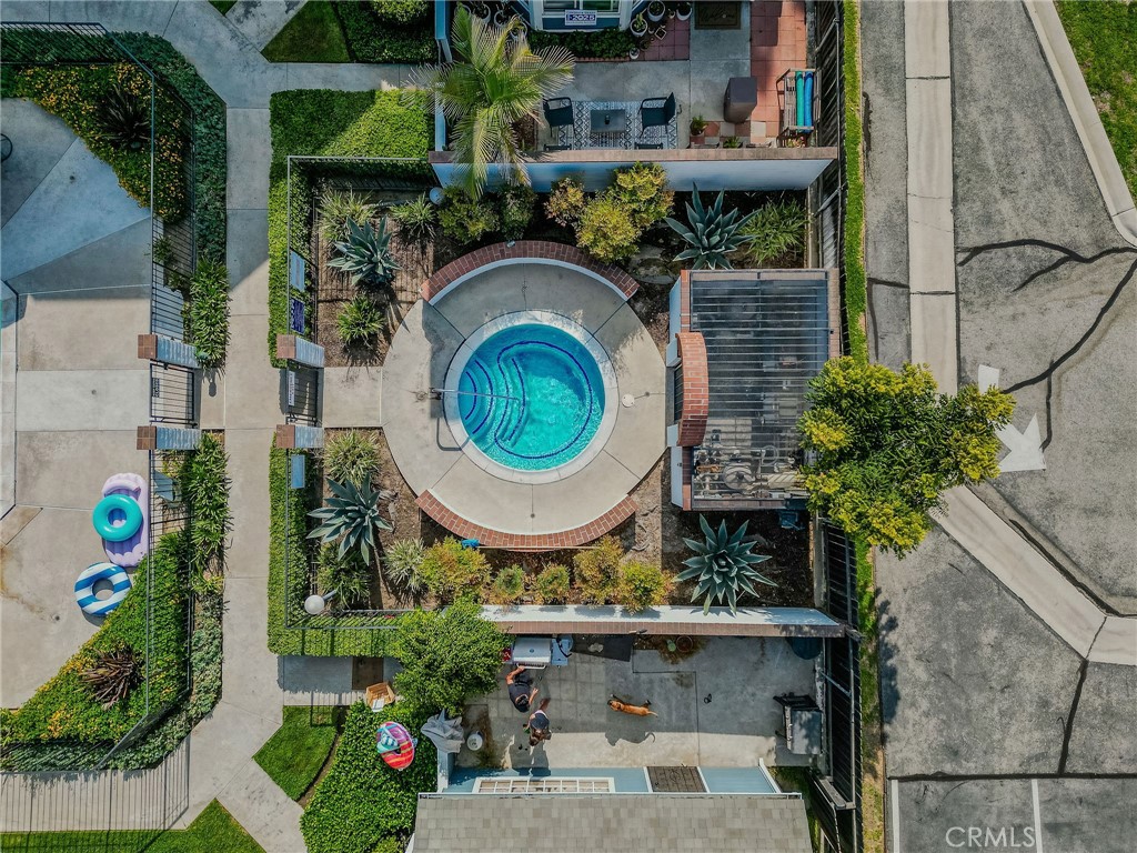 14738 Pioneer Boulevard Norwalk, CA 90650 - Photo 16 of 72 an aerial view of a house with a garden and outdoor seating