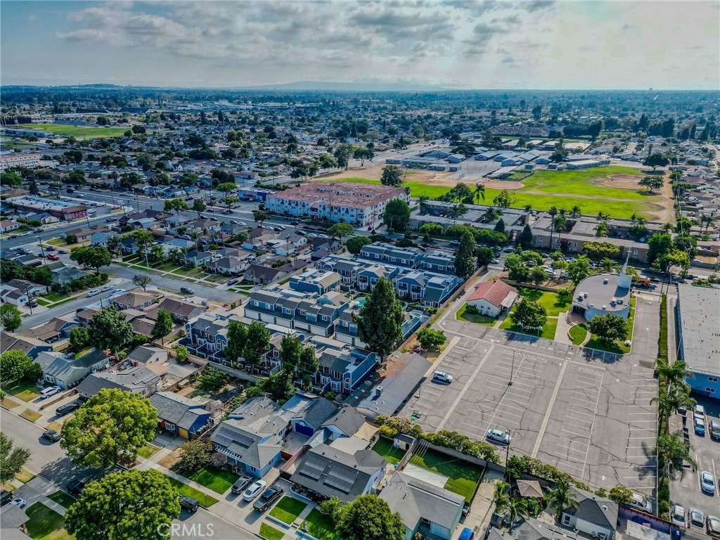 14738 Pioneer Boulevard Norwalk, CA 90650 - Photo 24 of 72 an aerial view of a house with a swimming pool yard and lake view