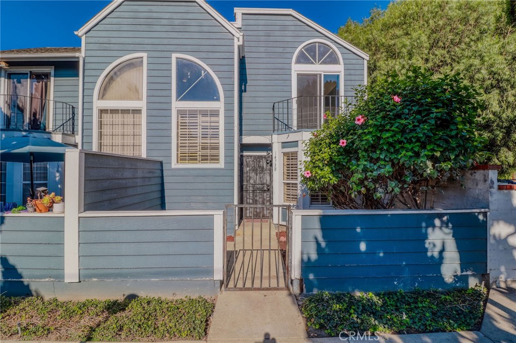 14738 Pioneer Boulevard Norwalk, CA 90650 - Photo 26 of 72 a front view of a house with a yard