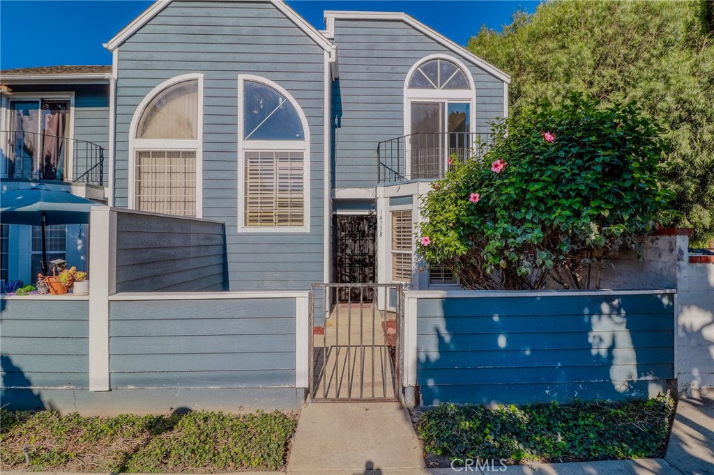 14738 Pioneer Boulevard Norwalk, CA 90650 - Photo 28 of 72 a front view of a house with a yard