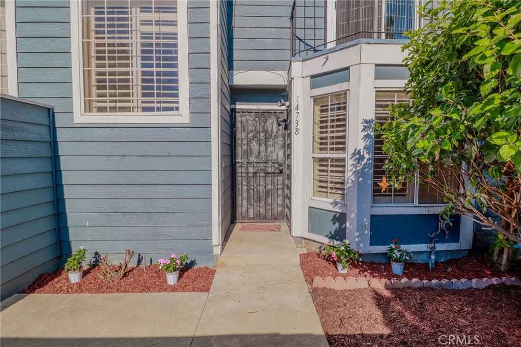 14738 Pioneer Boulevard Norwalk, CA 90650 - Photo 33 of 72 a front view of a house with a yard