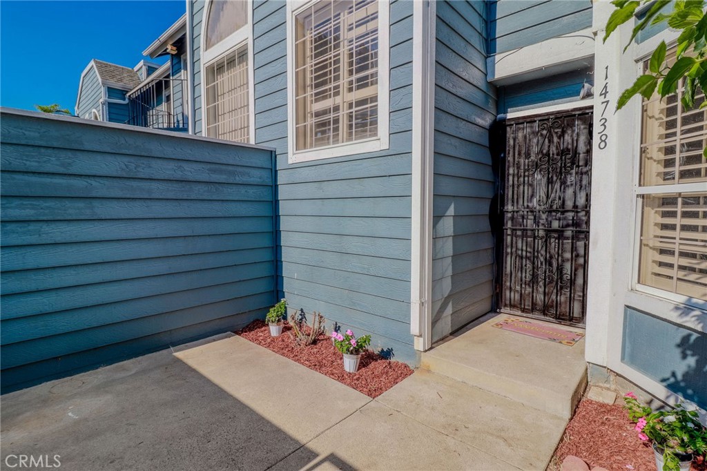 14738 Pioneer Boulevard Norwalk, CA 90650 - Photo 37 of 72 a view of wooden door and front door