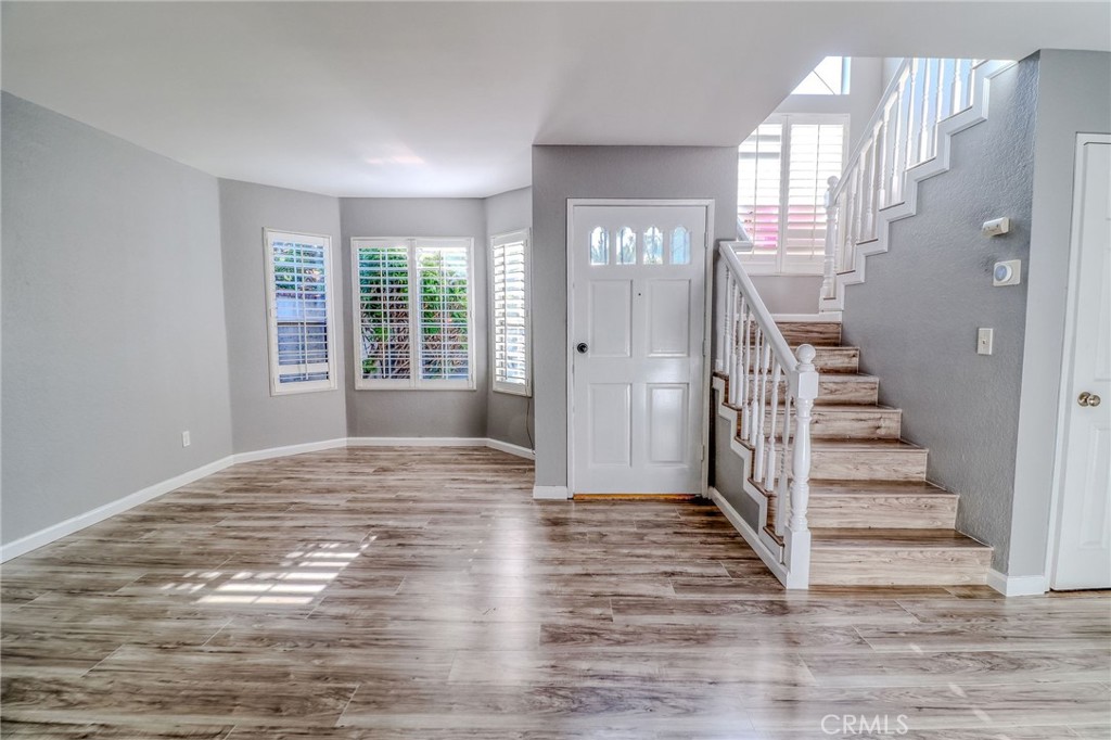 14738 Pioneer Boulevard Norwalk, CA 90650 - Photo 39 of 72 a view of a room with wooden floor and stairs