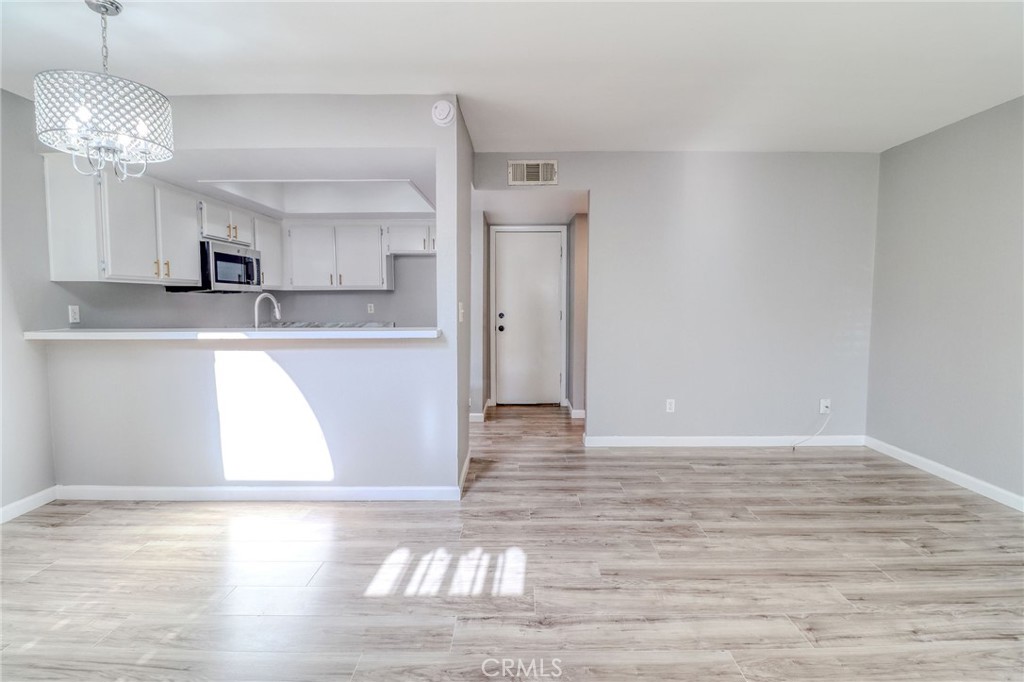 14738 Pioneer Boulevard Norwalk, CA 90650 - Photo 40 of 72 a view of a kitchen with microwave and cabinets
