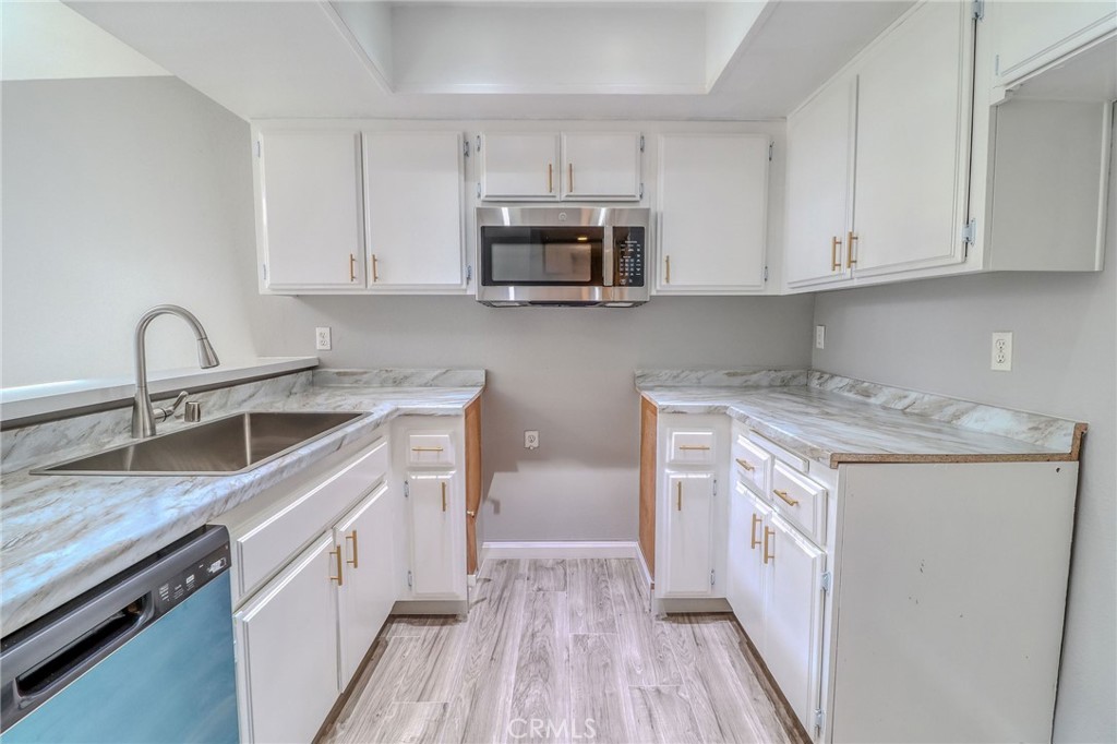 14738 Pioneer Boulevard Norwalk, CA 90650 - Photo 48 of 72 a kitchen with stainless steel appliances granite countertop a sink stove and refrigerator