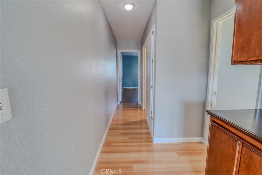 14738 Pioneer Boulevard Norwalk, CA 90650 - Photo 55 of 72 a view of a hallway with wooden floor and staircase