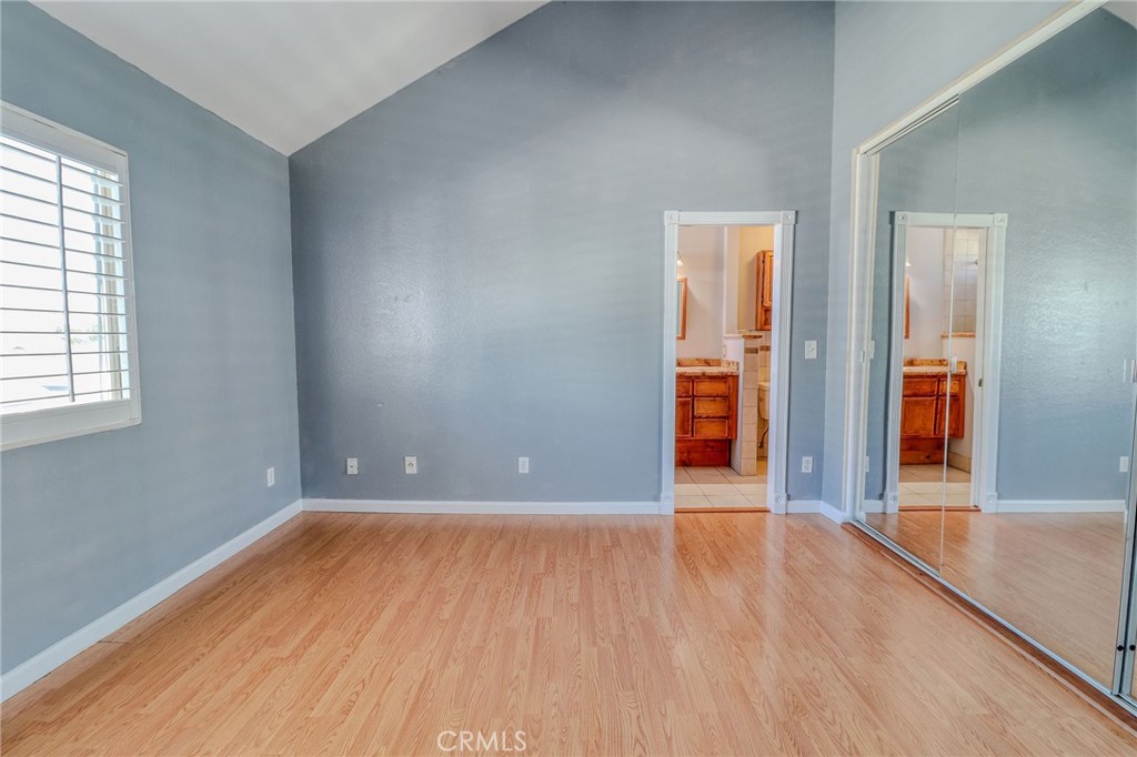 14738 Pioneer Boulevard Norwalk, CA 90650 - Photo 64 of 72 an empty room with wooden floor and windows