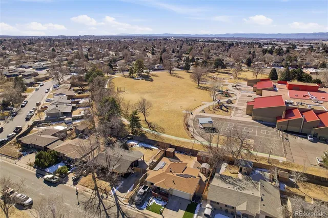 a kitchen with granite countertop a sink stainless steel appliances window and cabinets