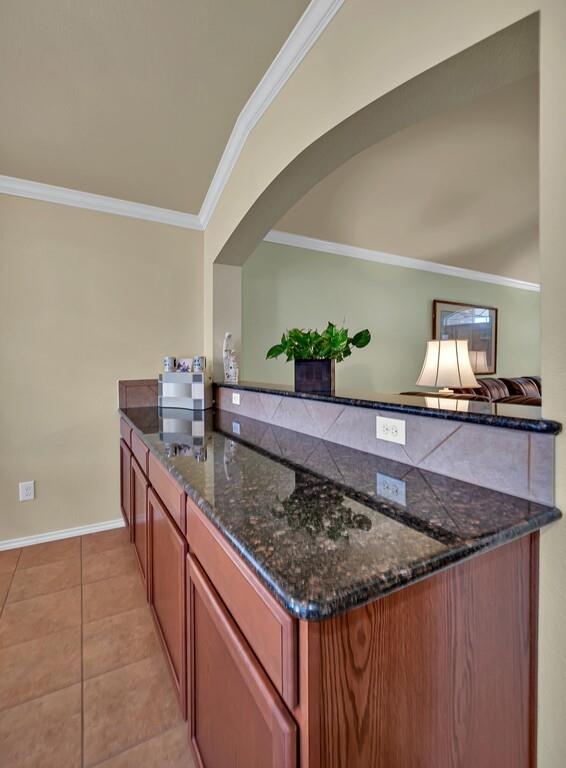 9836 Shallow Creek Drive Waco, TX 76708 - Photo 15 of 32 a kitchen with granite countertop a sink and a stove