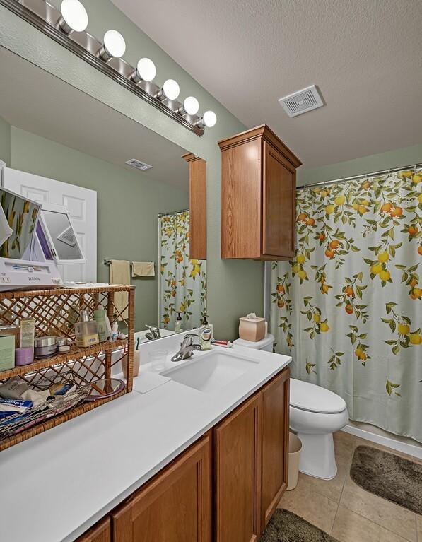 9836 Shallow Creek Drive Waco, TX 76708 - Photo 24 of 32 a bathroom with a sink toilet and shower