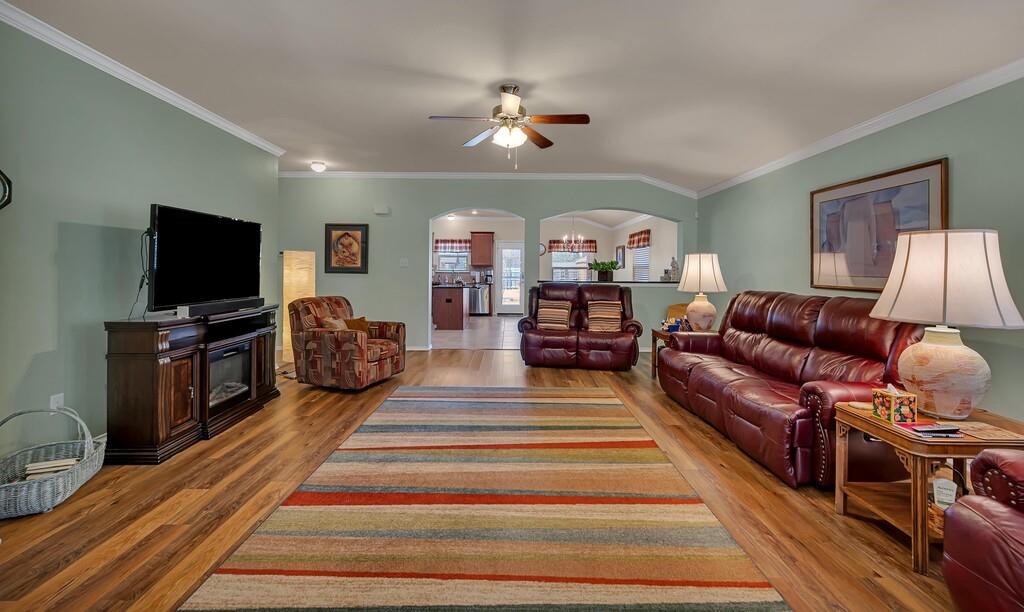 9836 Shallow Creek Drive Waco, TX 76708 - Photo 4 of 32 a living room with furniture and a flat screen tv