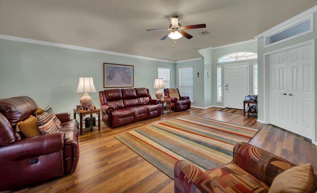 9836 Shallow Creek Drive Waco, TX 76708 - Photo 6 of 32 a living room with furniture a couch and wooden floor