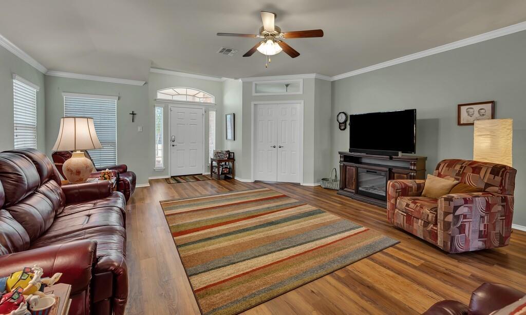 9836 Shallow Creek Drive Waco, TX 76708 - Photo 7 of 32 a living room with furniture and a flat screen tv