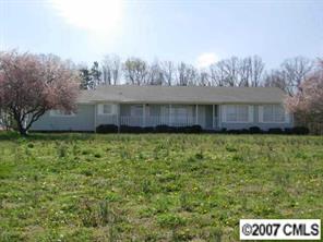2203 Mills Harris Road Wingate, NC 28174 - Photo 1 of 8 a view of a yard with a house