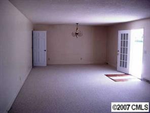 2203 Mills Harris Road Wingate, NC 28174 - Photo 3 of 8 an empty room with a window