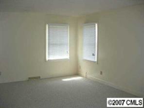 2203 Mills Harris Road Wingate, NC 28174 - Photo 6 of 8 a view of an empty room with a window