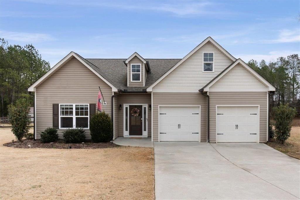 105 Cottage Way Cartersville, GA 30120 - Photo 1 of 1 a view of a house with a yard and garage